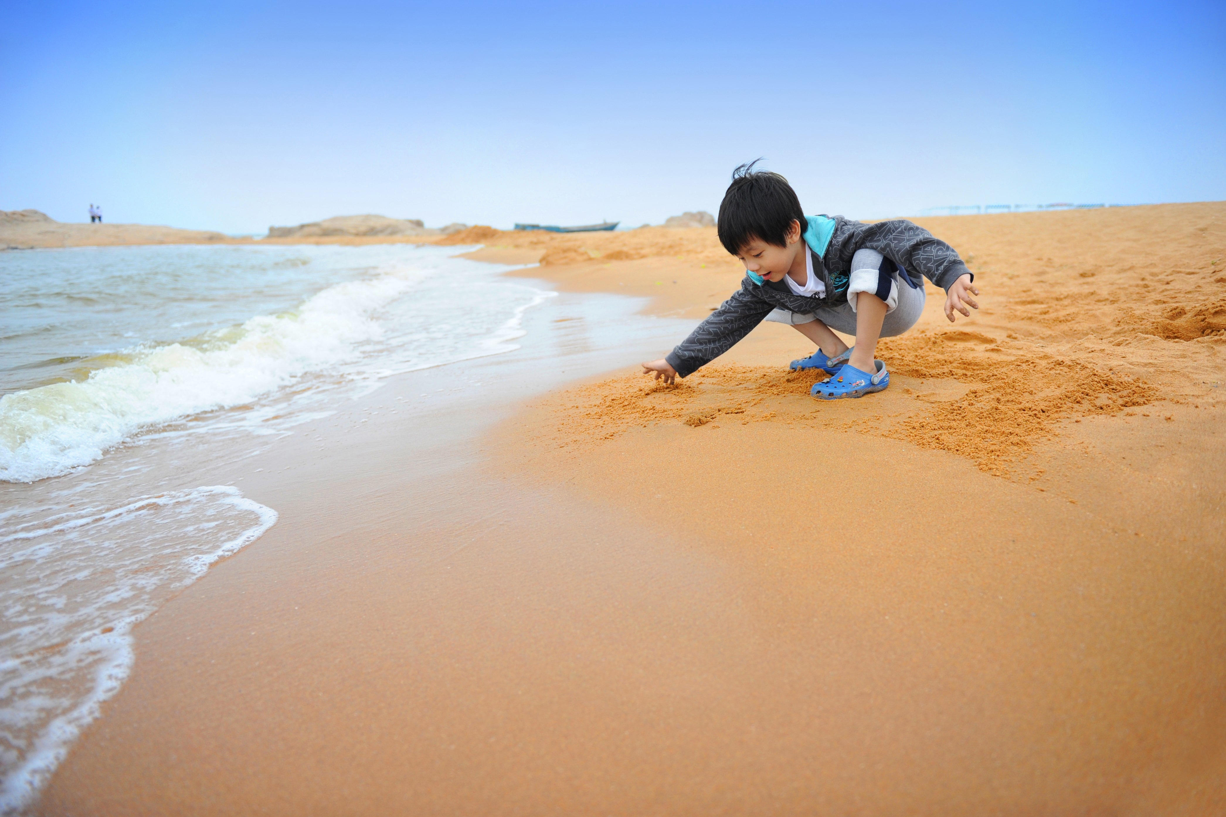 boy playing on the beach